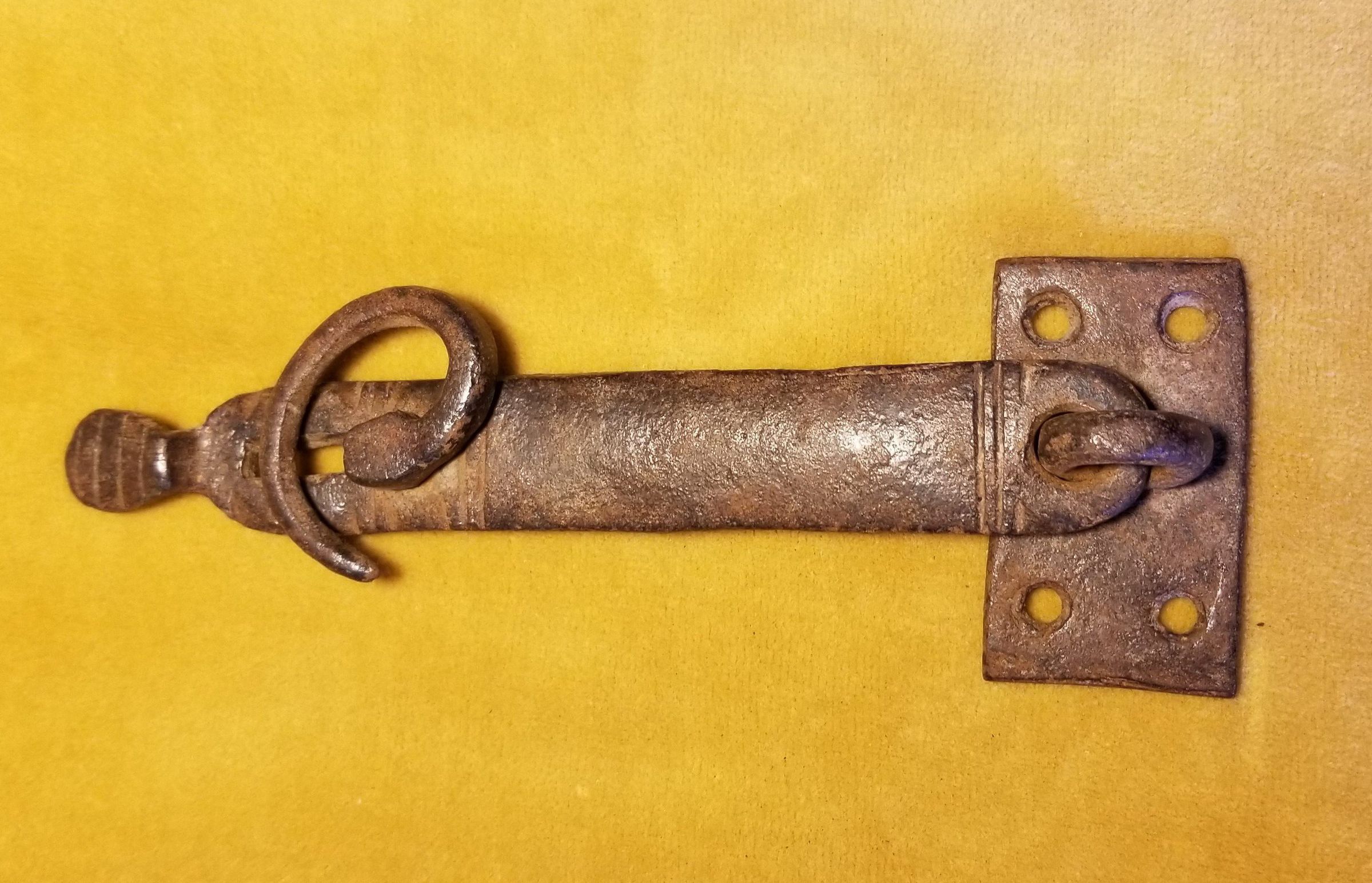 French iron hasp, mid-eighteenth century; A mid-eighteenth century French iron hasp with decorative striations and curved keeper, found in Edmunds, Maine.