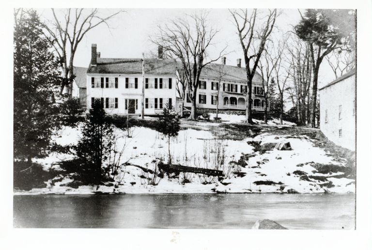          Riverside Inn and Dennys River Inn, Dennysville, Maine; The images shows the Riverside Inn on the left, with Dennys River Inn above and to the right, while John Allan's livery stable on the far right.
   
