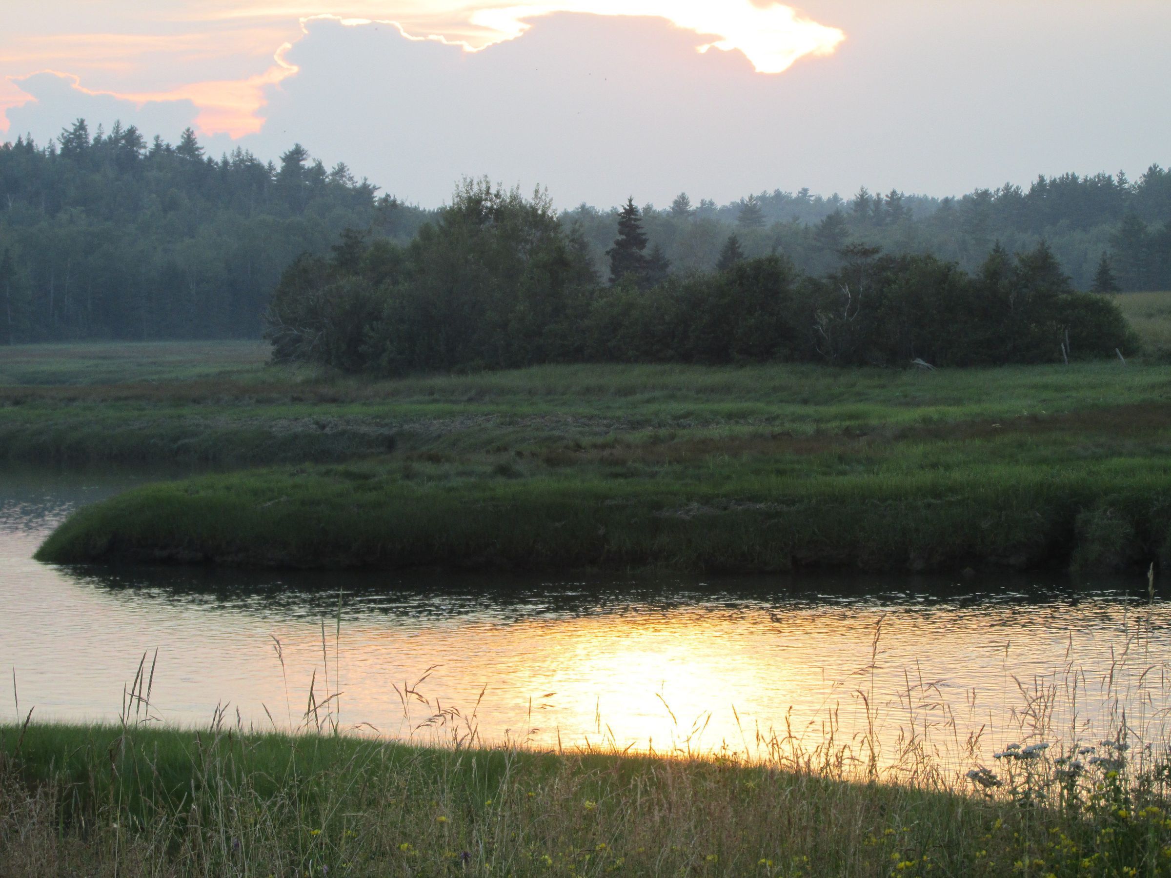 Hobart Stream at Sunset; Hay is still harvested in the fields beside the tidal estuary of Hobart Stream, seen here at sunset.