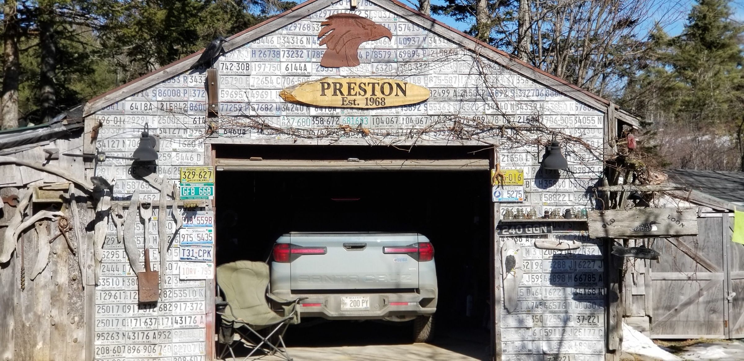 Preston's Garage, Dennysville Maine; A touch of humor and sense of history combine to establish this well decorated garage on Foster Lane in Dennysville, Maine.