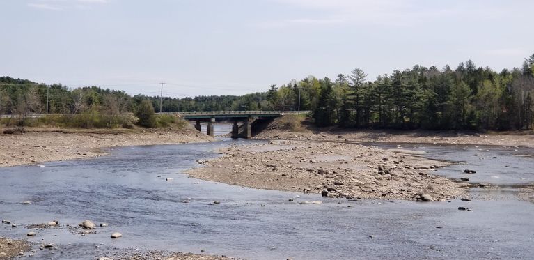          U.S. Route 1 Bridge over the Dennys River, Maine; The U.S. route 1 bridge over the Dennys River was built in 1955 to bypass the village of Dennysville.  At low tide the middle ground is exposed, which was at one time covered with a low growth of trees until scoured clean by the ice.
   