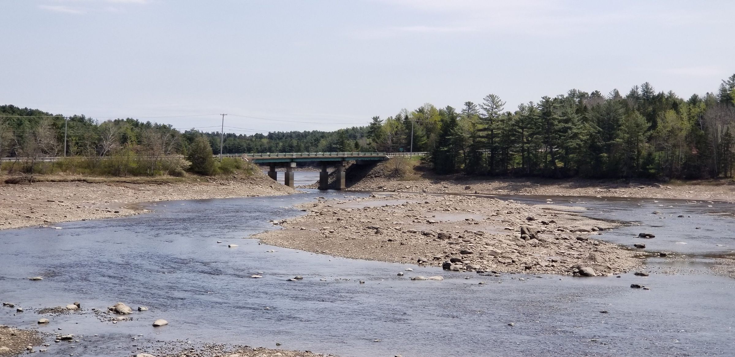 U.S. Route 1 Bridge over the Dennys River, Maine; The U.S. route 1 bridge over the Dennys River was built in 1955 to bypass the village of Dennysville. At low tide the middle ground is exposed, which was at one time covered with a low growth of trees until scoured clean by the ice.