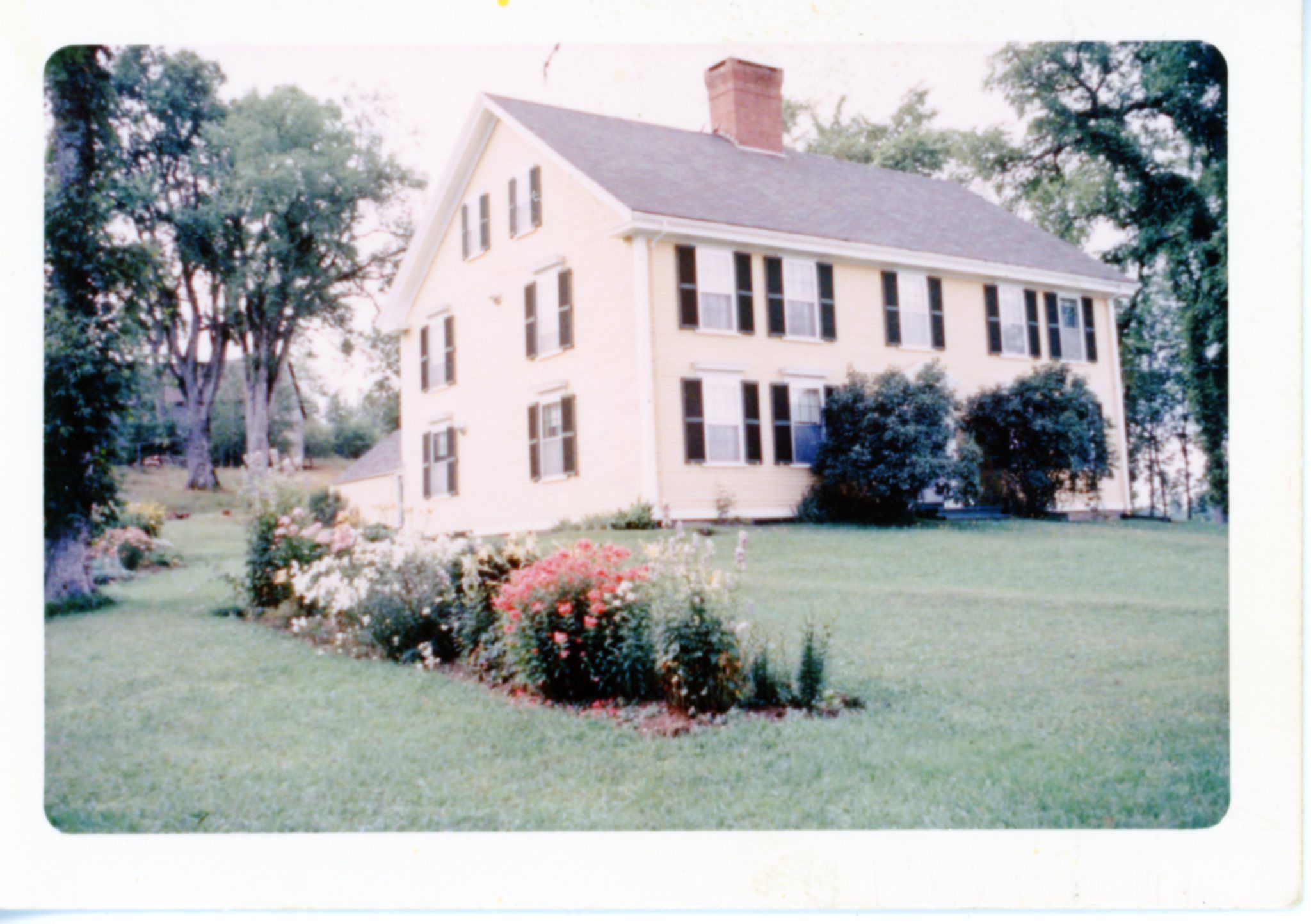 View of the Theodore Lincoln House, Dennysville, Maine, c. 1960; Exterior view of the Dennysville's Lincoln House when it was owned and operated by Dorothy Casey as a bed and breakfast establishment for passing travelers. The old barn can be seen on the hill behind the house, before it was taken down and removed in 1970.