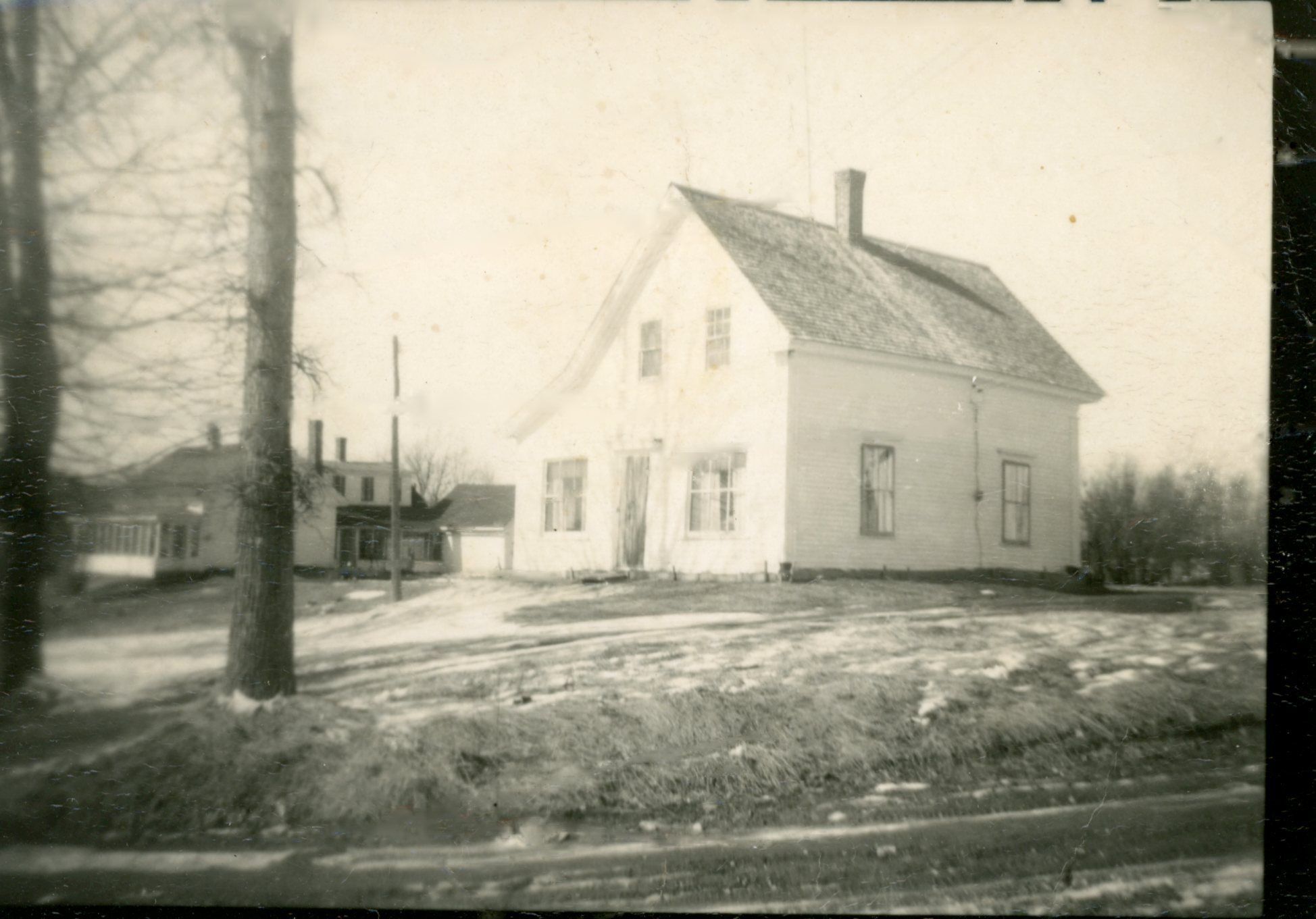 Howard Allan's House in Meddybemps, Maine, c. 1960; Howard Allan's house in Meddybemps village around 1960, which was located almost directly in front the Town Hall, with the Ward house visible beyond it.