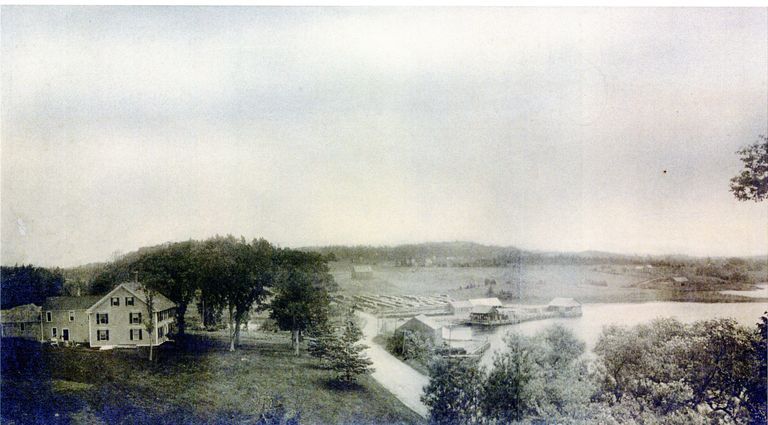          Theodore Lincoln House and Wharves, Dennysville, Maine, c. 1870; The Lincoln Dock stands in front of their house with a warehouse located on it, while the larger Lincoln town wharf is on the other side of Dock Bridge with a store, sail loft, and other buildings nearby.
   