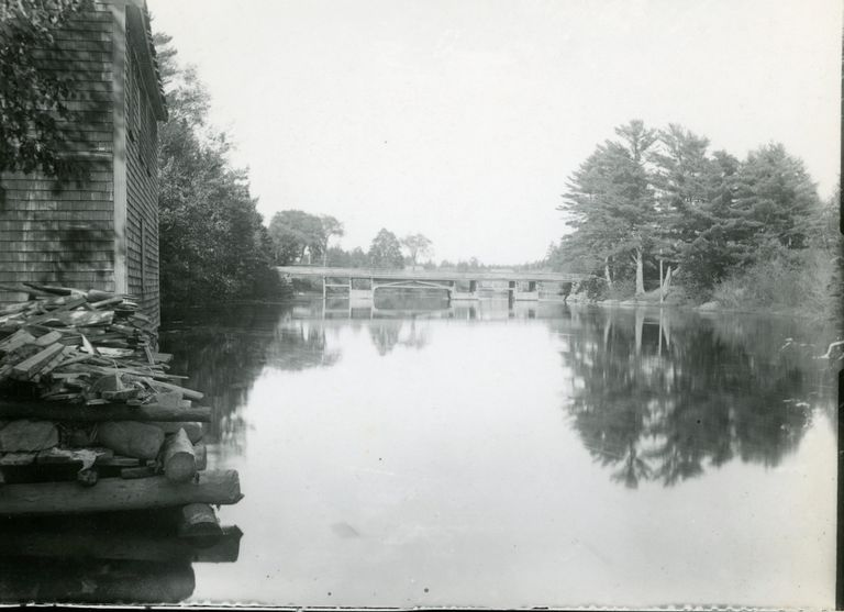          Lower Bridge over the Dennys River, Dennysville, Maine; Photograph of the Lower Bridge as seen upriver from Gardner's Store, in Dennysville, Maine.  Image from the Hallowell Collection courtesy of the Tides Institute in Eastport, Maine.
   