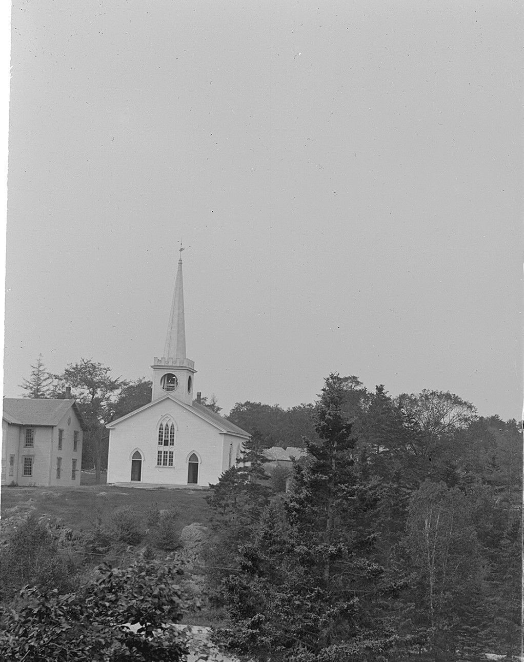 Dennysville Town School to the left of the Congregational Church building on Meetinghouse Hill, c. 1900