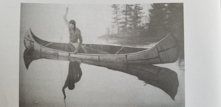          A lone Wabanaki fisherman poised to spear a fish from his birchbark canoe.; Reproduced with permission from 