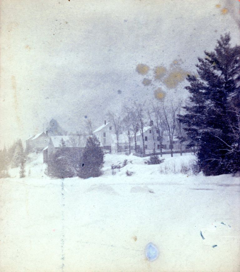          Riverside Inn and Livery Stable, Dennysville, Maine; John Allan's Livery stable is poised on the river bank across from the the Riverside Inn in this photograph from the early 1890's.  John Allan's store is beside the Inn, while Peter E. Vose's Store and T.W. Allan's stores are visible at the top of Store Hill.
   