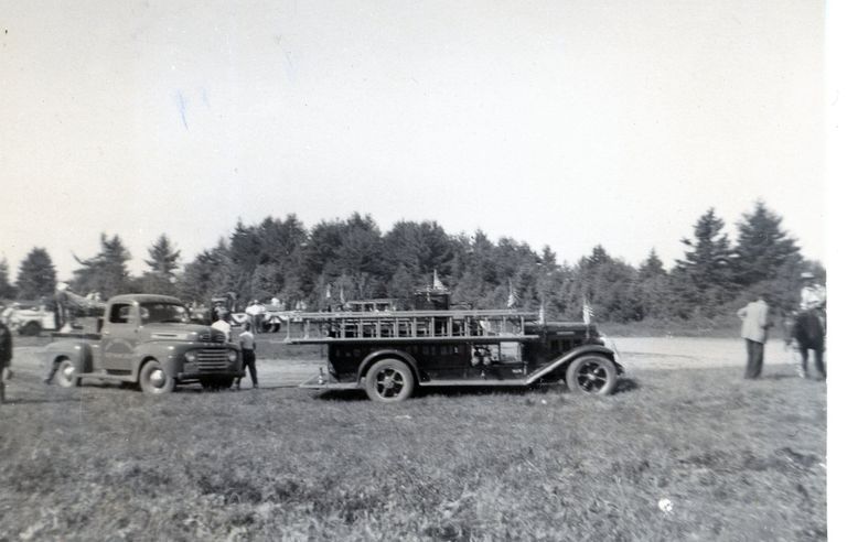          Dennysville Fire Truck at the Ball Diamond, Edmunds, Maine, on the Fourth of July, 1951.
   