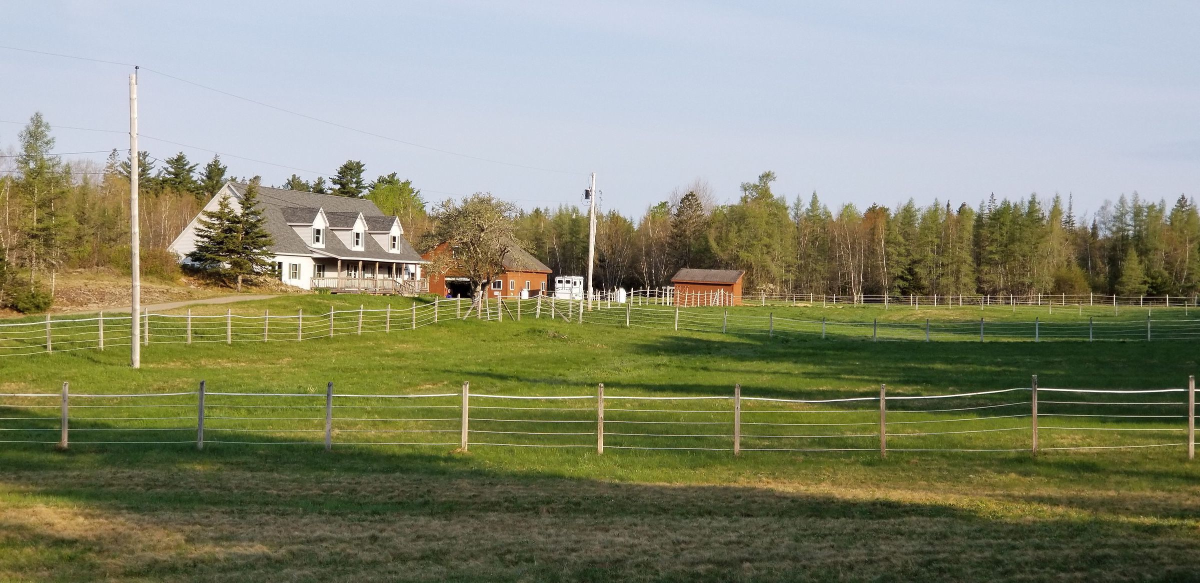 Site of the former Brown Family Farm; View of the former Brown family farm in Lower Dennysville, with current farmhouse and barns built by William and Kathy Attick.