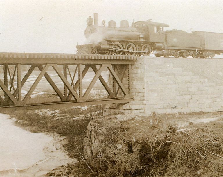          Steam Engine Crossing Dennys River Railroad Trestle Bridge, c. 1900
   