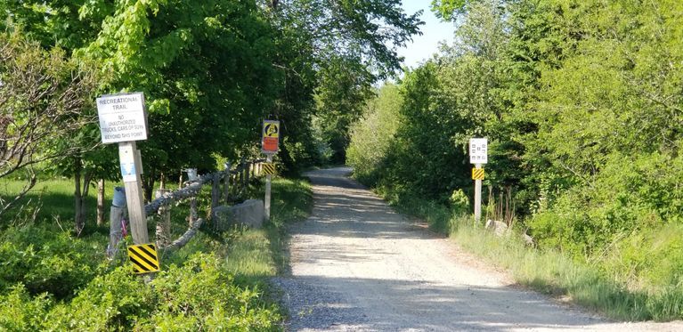          Sunrise Trail Crossing on Route 86, Edmunds, Maine; A recreational trail follows the route of the former Washington County Railroad, seen here crossing Route 86, near the Dennys River ATV Club.
   