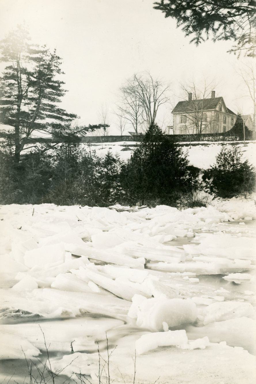 Ice on the Dennys River, Dennysville, Maine; Image of the ice jam in the Dennys River in front of the Congregational Parsonage, in a photograph taken by Dr. John P. Sheahan c. 1890.